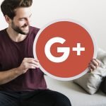 Person holding a Google Plus icon